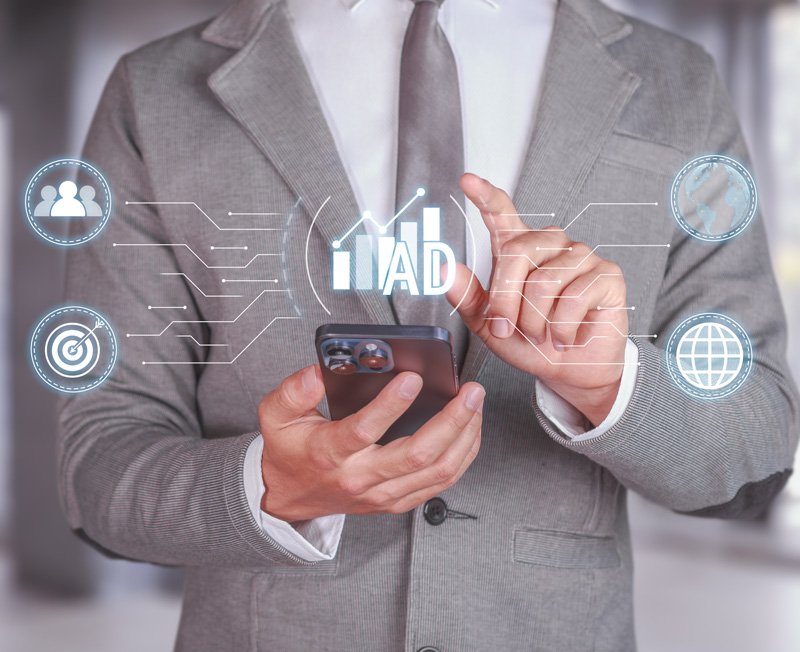 Business professional managing campaigns on a mobile device